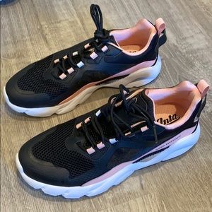 Pink and black sneakers
